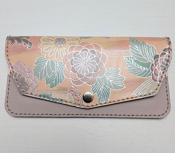 “Chrysanthemum Wallet”, 2025 — long wallet in dusty rose with silver and gold chrysanthemums and a foiled butterfly
